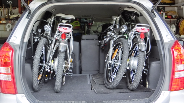 Two ezi RIDER Electric Bikes folded up in Hatchback